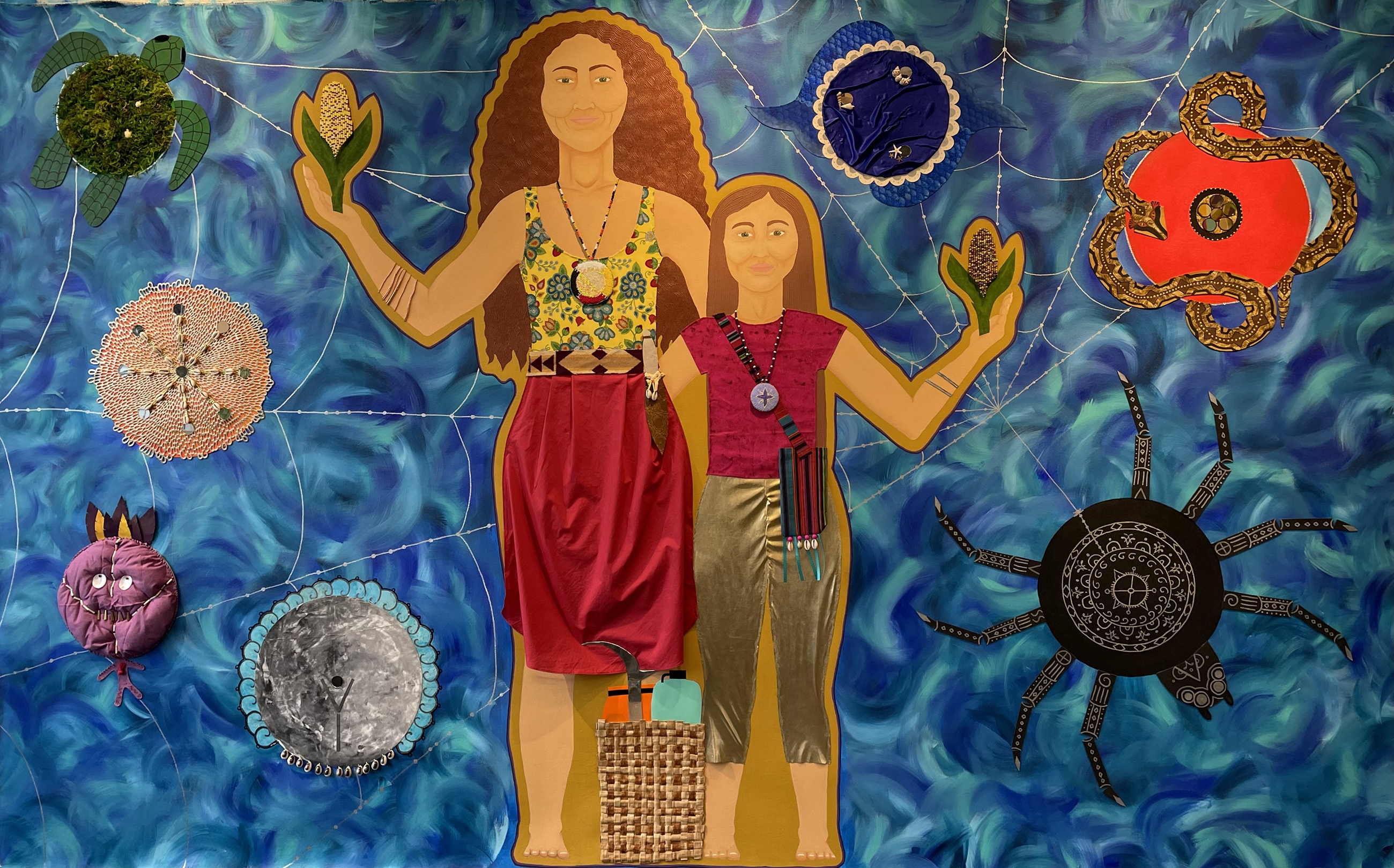 Mixed media artwork with two female figures side-by-side alongside a snake, a turtle, a spider and its web, and other objects layered upon a blue wavelike background.